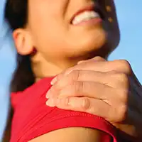 photo of woman with sore shoulder